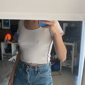 brandy melville white tee with black crosstitch